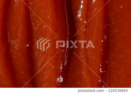 Macro texture of ketchup, natural traditional tomato sauce, top view, culinary background. 128316663