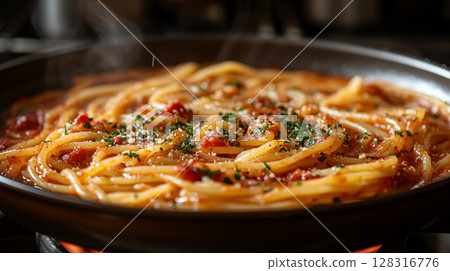 Spaghetti pasta in tomato sauce cooking in frying pan with herbs and parmesan, traditional Italian homemade dinner preparation 128316776