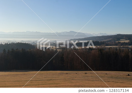 Beautiful landscape with a clear blue sky and a few trees Beautiful landscape with a clear blue sky and a few trees 128317134