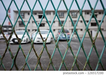 Fence surrounding an apartment building 128317280
