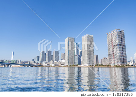 Harumi, Chuo Ward, Tokyo - A group of high-rise apartment buildings (tower apartments) in Harumi on a clear day Harumi, Chuo Ward, Tokyo - A group of high-rise apartment buildings (tower apartments) in Harumi on a clear day 128317396