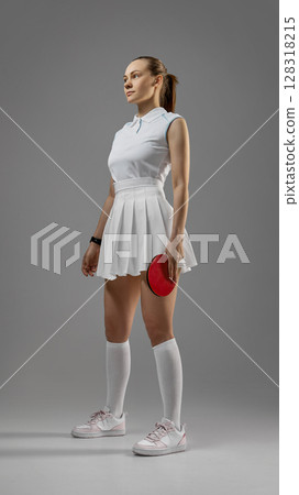 Assured woman athlete prepared for table tennis match Assured woman athlete prepared for table tennis match 128318215