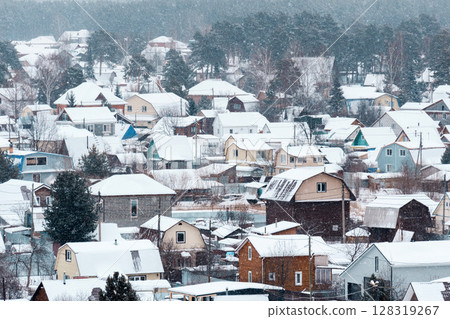 Nestled in a quiet area, the village is draped in soft white snow, transforming each house into a picturesque winter 128319267