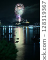 Fireworks reflected on the surface of the water 128319367