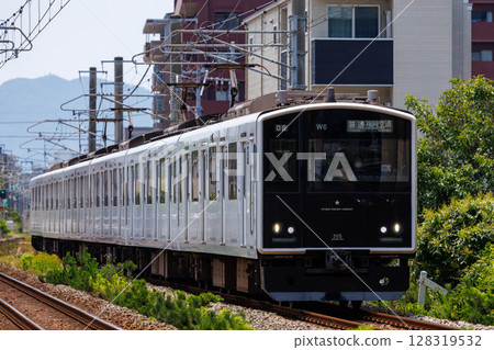 JR Chikuhi Line 305 series DC train running on the Fukuoka Municipal Subway JR Chikuhi Line 305 series DC train running on the Fukuoka Municipal Subway 128319532
