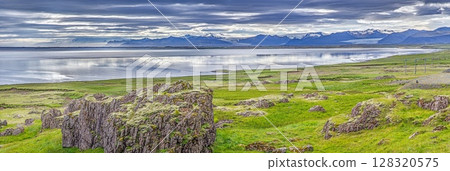 Panoramic view of Hofn Iceland with Vatnajokull glacier and dramatic sky 128320575