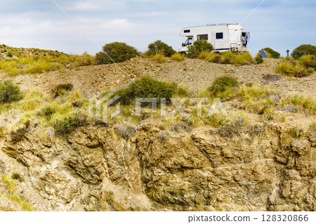Camper on cliff, coast in Spain 128320866