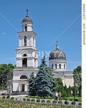 CHISINAU, MOLDOVA - JUNE 20, 2025 The Metropolitan Cathedral Nativity of the Lord with the bell tower, architectural centerpiece of moldovan capital. Summer season beautiful view to the landmark 128320945