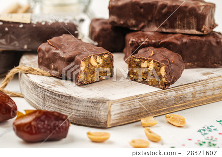 Chocolate peanut protein bars with dates Chocolate peanut protein bars with dates 128321607