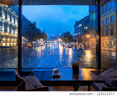 Rainy day at the hotel restaurant 128322551