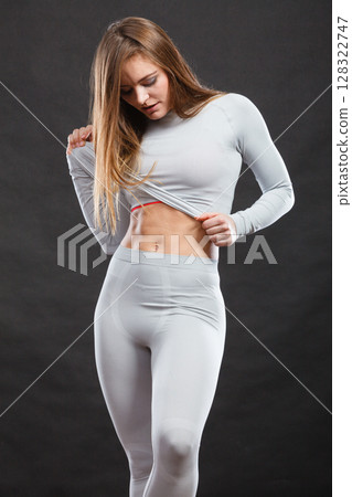 Sporty woman wearing thermoactive underwear. Sporty woman wearing thermoactive underwear. 128322747