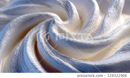 Textured white and cream abstract swirls resembling thick paint or sculpted frosting in soft lighting 128322906