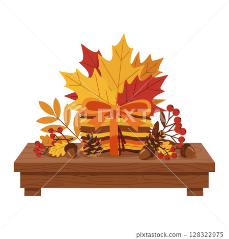 Autumn gift box with fall leaves berries and pine cones on wooden table decoration Autumn gift box with fall leaves berries and pine cones on wooden table decoration 128322975