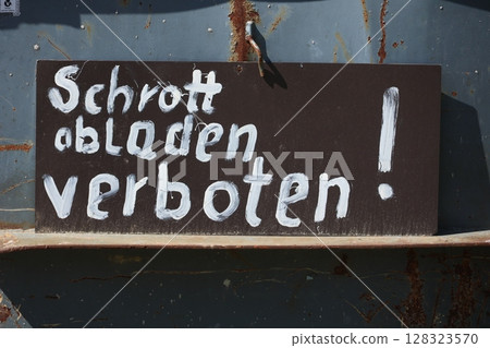 Sign with the German words "Schrott abladen verbote" written on it, Sign with the German words "Schrott abladen verbote" written on it, 128323570