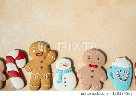 Gingerbread cookies with icing decoration. Christmas food. Gingerbread man baking gift. Top view table. Xmas sweet copy space background Gingerbread cookies with icing decoration. Christmas food. Gingerbread man baking gift. Top view table. Xmas sweet copy space background 128324562