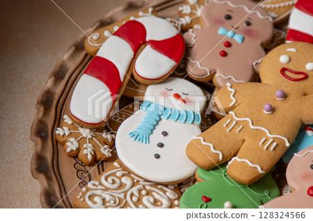 Gingerbread cookies with icing. Christmas food. Gingerbread man baking. Top view table Gingerbread cookies with icing. Christmas food. Gingerbread man baking. Top view table 128324566