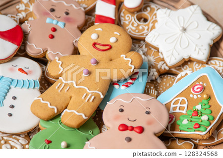 Set different gingerbread cookies with icing decoration. Christmas baking food. Gingerbread man. Xmas sweets treats background Set different gingerbread cookies with icing decoration. Christmas baking food. Gingerbread man. Xmas sweets treats background 128324568