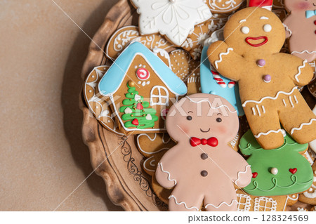 Gingerbread cookies with icing decoration. Christmas food. Gingerbread man baking. Top view table. Xmas sweet bakery Gingerbread cookies with icing decoration. Christmas food. Gingerbread man baking. Top view table. Xmas sweet bakery 128324569