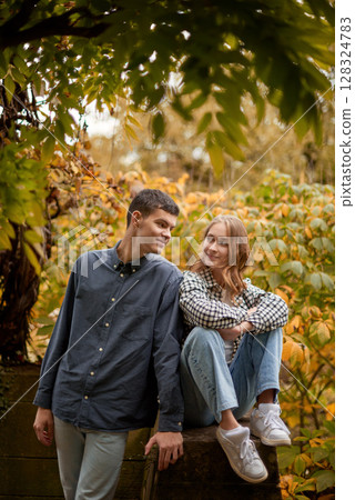 Young Cute Female Hugs Boyfriend. In Autumn Outdoor. Lovers Walking in Park. Attractive Funny Couple. Lovestory in Forest. Man and Woman. Cute Lovers in the Park. Family Concept. Happy Couple. Young Cute Female Hugs Boyfriend. In Autumn Outdoor. Lovers Walking in Park. Attractive Funny Couple. Lovestory in Forest. Man and Woman. Cute Lovers in the Park. Family Concept. Happy Couple. 128324783