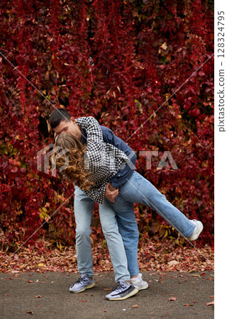 Young Cute Female Hugs Boyfriend. In Autumn Outdoor. Lovers Walking in Park. Attractive Funny Couple. Lovestory in Forest. Man and Woman. Cute Lovers in the Park. Family Concept. Happy Couple. Young Cute Female Hugs Boyfriend. In Autumn Outdoor. Lovers Walking in Park. Attractive Funny Couple. Lovestory in Forest. Man and Woman. Cute Lovers in the Park. Family Concept. Happy Couple. 128324795