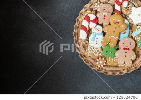 Gingerbread cookies with icing decoration. Christmas dessert food. Gingerbread man baking. Xmas sweets copy space Gingerbread cookies with icing decoration. Christmas dessert food. Gingerbread man baking. Xmas sweets copy space 128324796