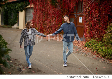 Young Cute Female Hugs Boyfriend. In Autumn Outdoor. Lovers Walking in Park. Attractive Funny Couple. Lovestory in Forest. Man and Woman. Cute Lovers in the Park. Family Concept. Happy Couple. Young Cute Female Hugs Boyfriend. In Autumn Outdoor. Lovers Walking in Park. Attractive Funny Couple. Lovestory in Forest. Man and Woman. Cute Lovers in the Park. Family Concept. Happy Couple. 128324804