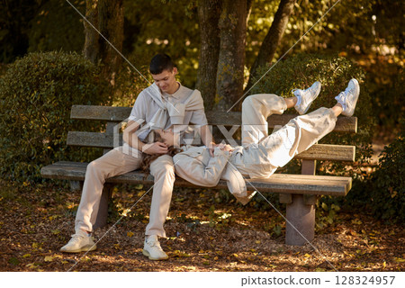 Young Cute Female Hugs Boyfriend. In Autumn Outdoor. Lovers Walking in Park. Attractive Funny Couple. Lovestory in Forest. Man and Woman. Cute Lovers in the Park. Family Concept. Happy Couple. Young Cute Female Hugs Boyfriend. In Autumn Outdoor. Lovers Walking in Park. Attractive Funny Couple. Lovestory in Forest. Man and Woman. Cute Lovers in the Park. Family Concept. Happy Couple. 128324957