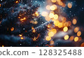 Illuminated Christmas tree branches with golden bokeh lights during snowfall 128325488