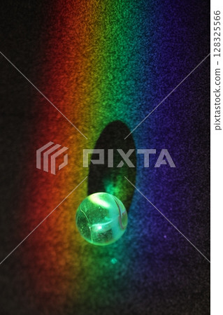 Ball is sitting in a hole in a rainbow Ball is sitting in a hole in a rainbow 128325566