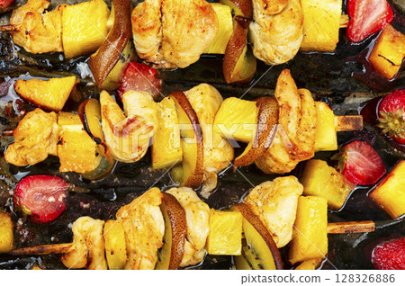 Grilled chicken on bamboo skewers. Grilled chicken on bamboo skewers. 128326886