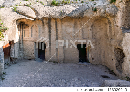 Ancient cave dwellings and rock-cut churches at Goreme Open-Air Museum, Cappadocia, Turkey. 128326943