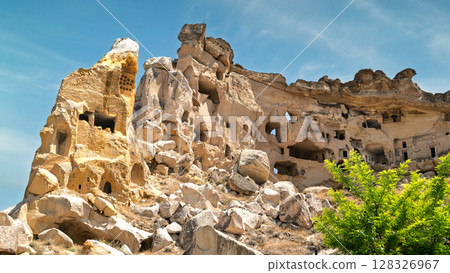 Ancient rock-cut dwellings of Cavus Castle, or Cavusin Kalesi, in Cappadocia, Turkey Ancient rock-cut dwellings of Cavus Castle, or Cavusin Kalesi, in Cappadocia, Turkey 128326967