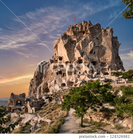 Historic Uchisar Castle with ancient cave dwellings at sunset, Uchisar, Cappadocia, Turkey Historic Uchisar Castle with ancient cave dwellings at sunset, Uchisar, Cappadocia, Turkey 128326981