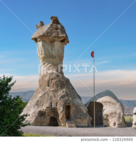 Iconic Fairy Chimney rock formation in Pasabag Valley, aka Monks Valley, Cappadocia, Turkey 128326989