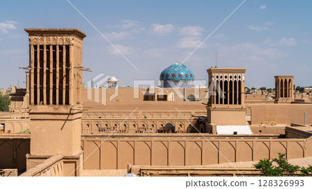 Yazd cityscape featuring traditional mudbrick buildings, iconic windcatcher towers, and Iranian architecture 128326993