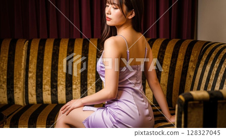 The back view of a hostess in a dazzling purple dress The back view of a hostess in a dazzling purple dress 128327045