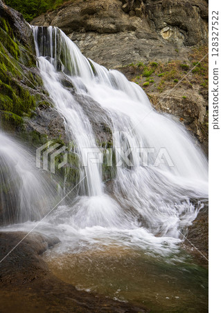 Big beautiful waterfall. Travel in Bulgaria. Hristovski waterfall. Vertical view 128327522