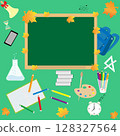 A green blackboard and various school supplies for returning to school 128327564