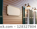Exterior View of a House Showing a Blank Sign and Shutters 128327804