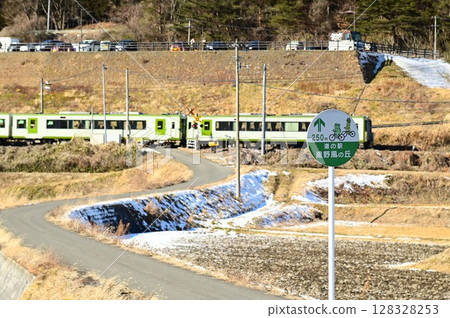 Roadside station Tono Kaze no Oka and the Kamaishi Line as seen from the rice paddy fields of Tono Roadside station Tono Kaze no Oka and the Kamaishi Line as seen from the rice paddy fields of Tono 128328253