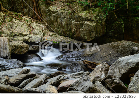 Along the Crystal Cascades near Cairns in Far North Queensland, locals and tourists enjoy swimming, hiking, picnicking, and exploring lush rainforest and freshwater streams. Along the Crystal Cascades near Cairns in Far North Queensland, locals and tourists enjoy swimming, hiking, picnicking, and exploring lush rainforest and freshwater streams. 128328656
