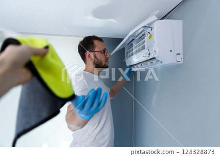 Professional Air Conditioner Maintenance: Ensuring Optimal Performance and Cleanliness in Home Cooling Systems with Proper Techniques and Tools for a Comfortable Environment Professional Air Conditioner Maintenance: Ensuring Optimal Performance and Cleanliness in Home Cooling Systems with Proper Techniques and Tools for a Comfortable Environment 128328873