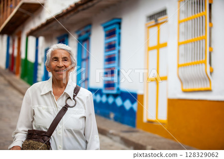 Senior woman at the beautiful colonial town of Concepcion located in the department of Antioquia in Colombia. 128329062