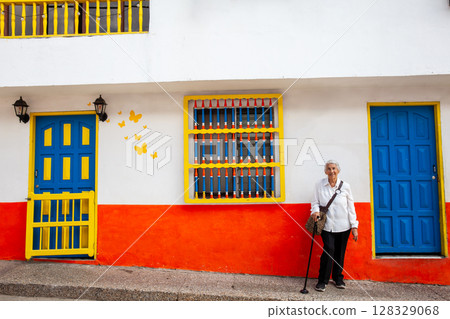 Senior woman at the beautiful colonial town of Concepcion located in the department of Antioquia in Colombia. 128329068