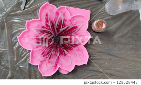 A Beautifully Designed Pink Flower-Shaped Resin Mold with Intricate Patterns for Crafting Unique Decorative Items in Creative Art Projects 128329445