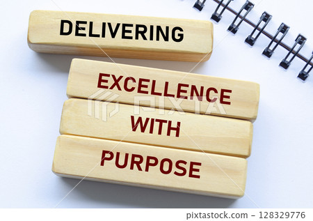 Delivering Excellence With Purpose text on wooden blocks. Quality delivery concept Delivering Excellence With Purpose text on wooden blocks. Quality delivery concept 128329776