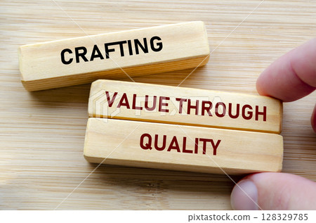 Crafting value through quality text on wooden blocks represents the foundation of excellence and dedication in every detail Crafting value through quality text on wooden blocks represents the foundation of excellence and dedication in every detail 128329785