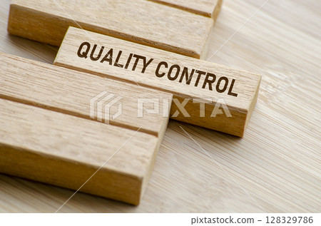 Quality Control text on wooden blocks. Business and Quality control concept Quality Control text on wooden blocks. Business and Quality control concept 128329786