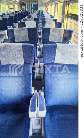 Inside View of a Modern Train Coach Featuring Comfortable Blue Fabric Seats with Clean Covers and Ample Space for Passengers and Their Baggage, Ideal for Long Journeys 128329831