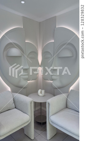 Contemporary Art Installation Featuring Sculpted Faces in a Minimalist Corner with Two Elegant Chairs and a Round Table, Creating an Inviting and Modern Atmosphere 128329832